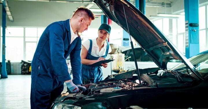 automotive service technicians working on a vehicle